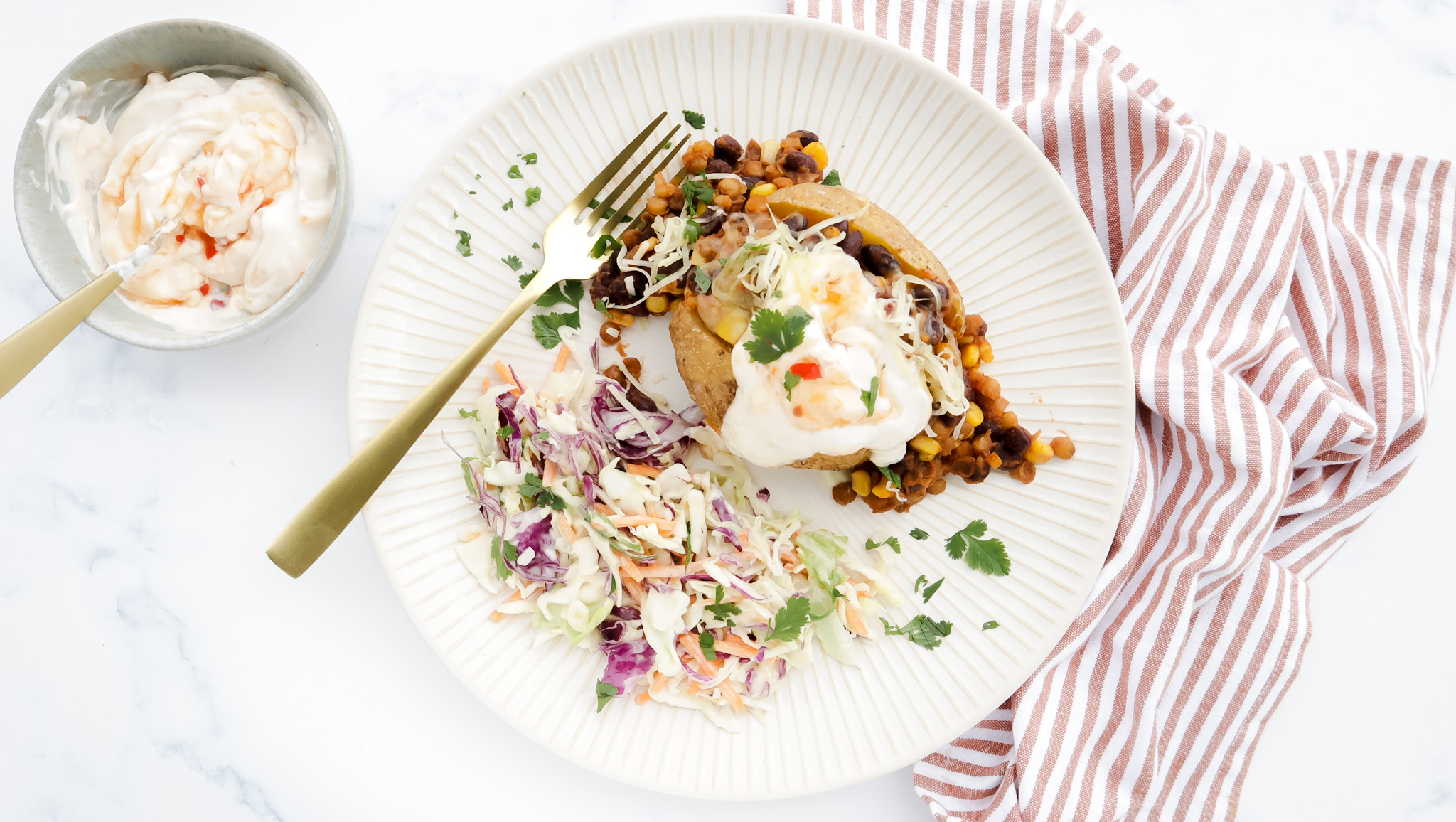 Mexican veggie jacket potatoes with slaw, sweet chilli sour cream recipe