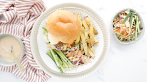 Asian-style crispy chicken burgers with fries & Asian slaw recipe