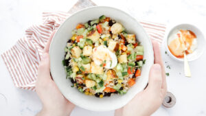 Mexican-style haloumi & veggie rice bowls with sweet chilli cream recipe