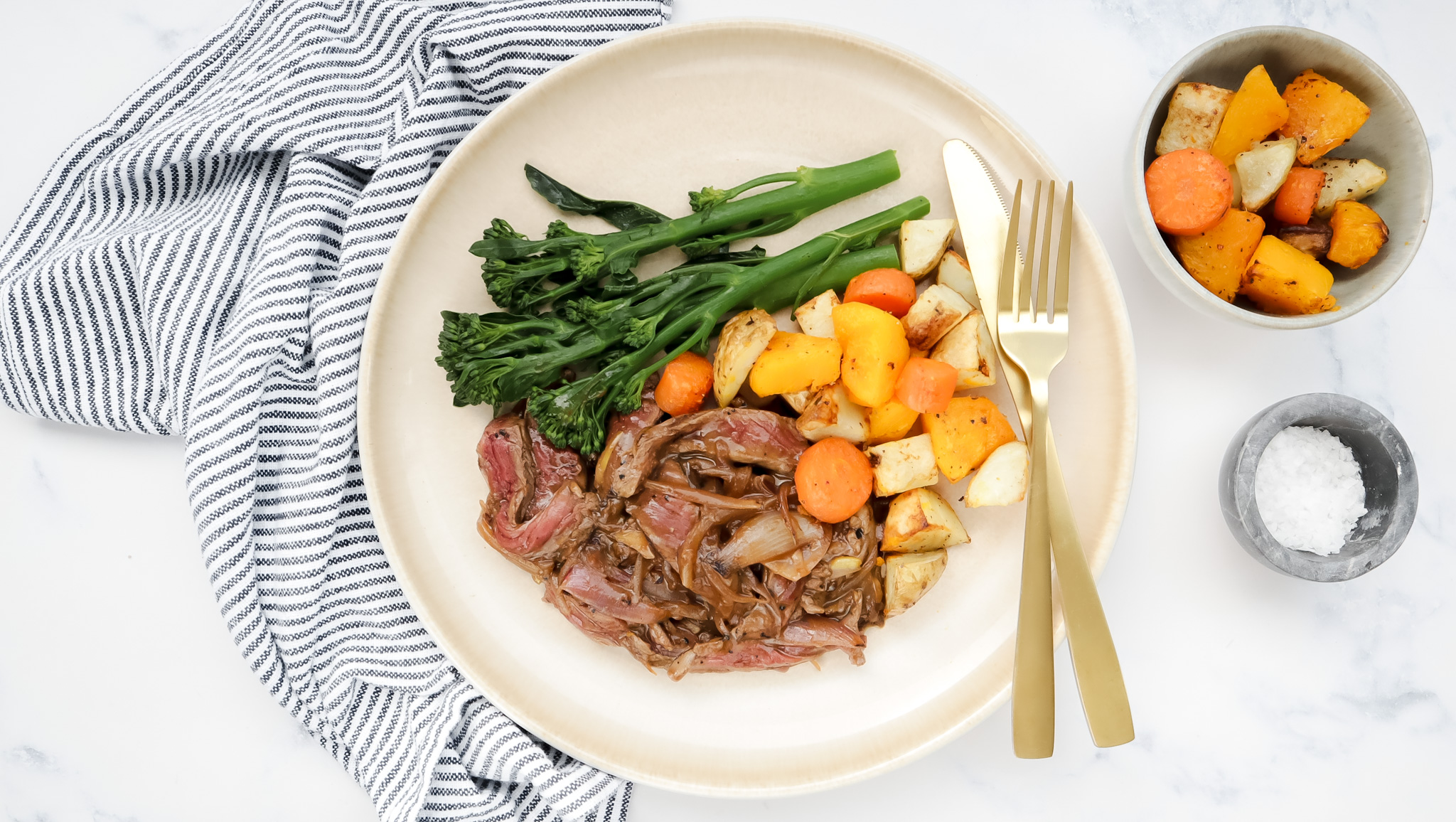 Beef & caramelised onion gravy with roasties & broccolini recipe