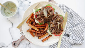Beef & caramelised onion on ciabatta with sweet potato chips & creamy pesto recipe