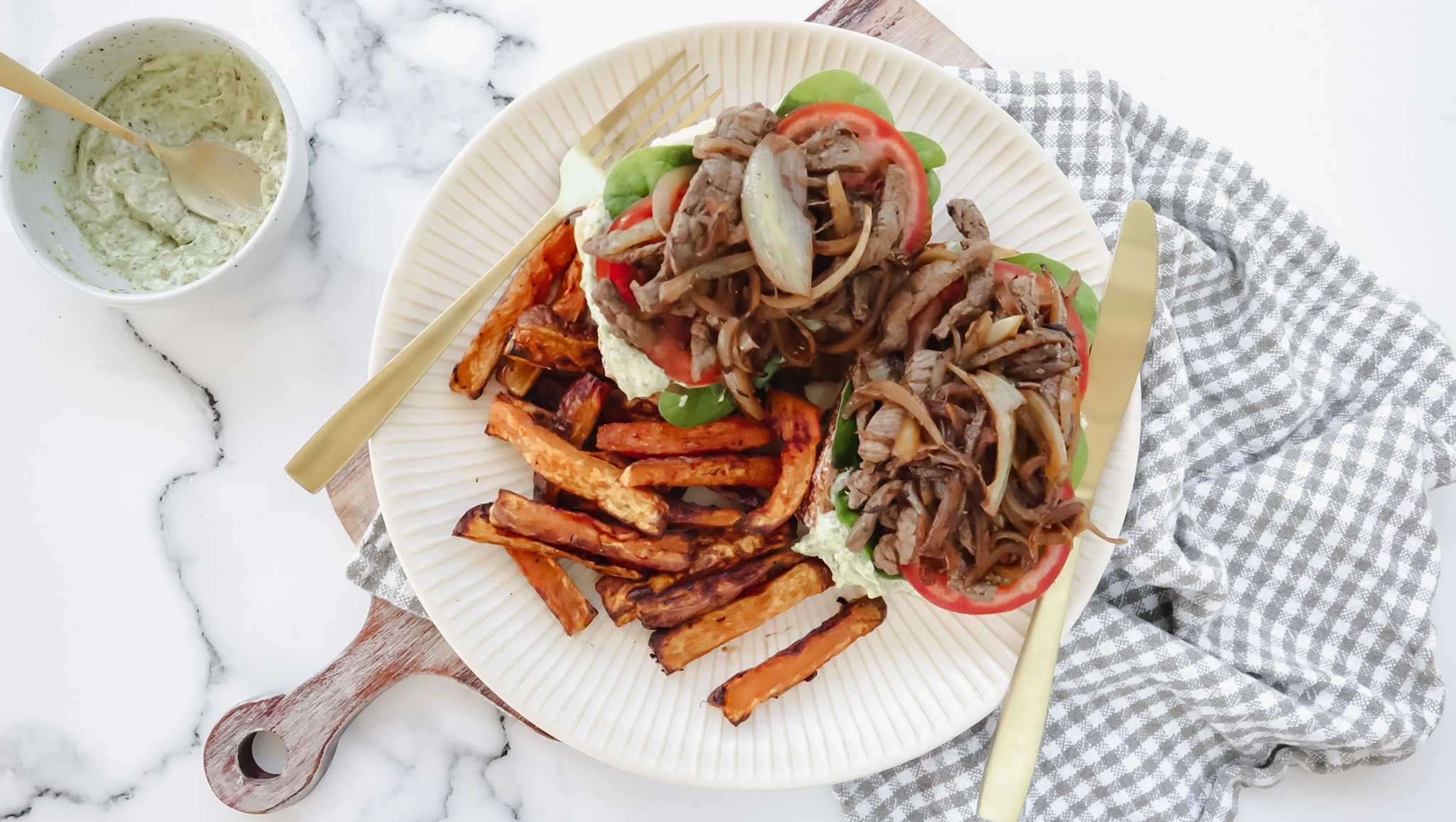 Beef & caramelised onion on ciabatta with sweet potato chips & creamy pesto recipe