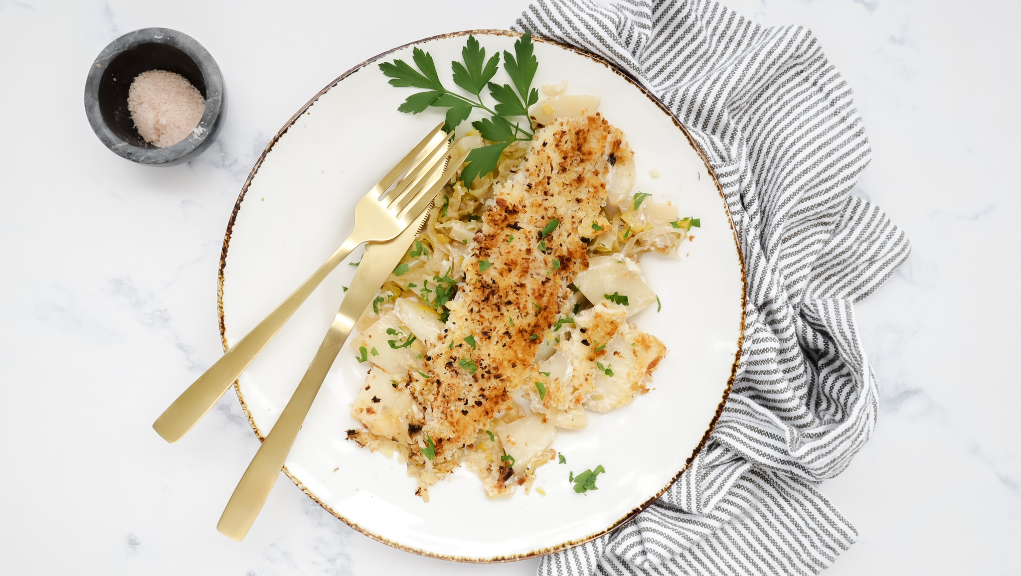 Creamy fish on leek & potato gratin with parmesan crisp recipe