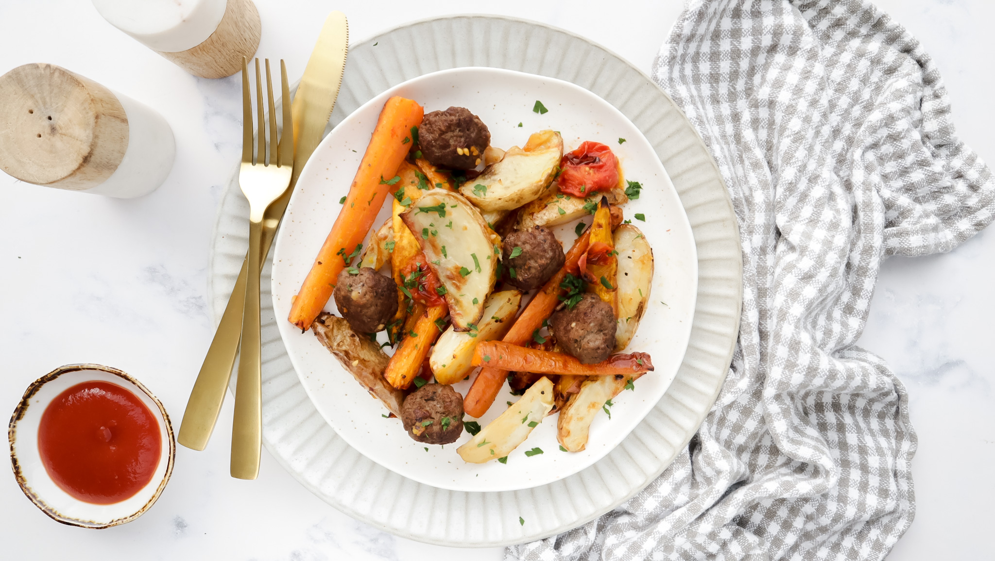 Lamb meatballs with cherry tomatoes, sweet potato, potato & carrots