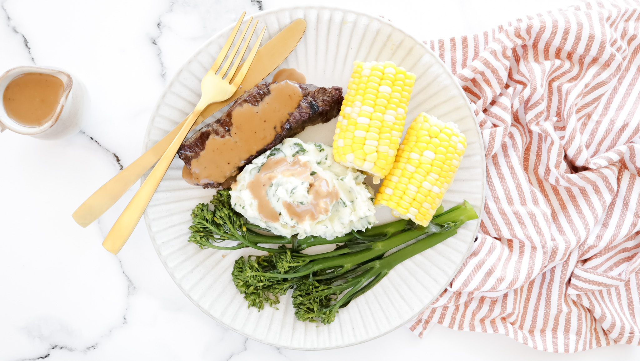 Seared beef sirloin with creamy peppercorn sauce, spinach & potato mash & corn recipe