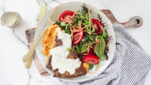 Seared beef steak with creamy parmesan sauce, sweet potato mash & salad recipe