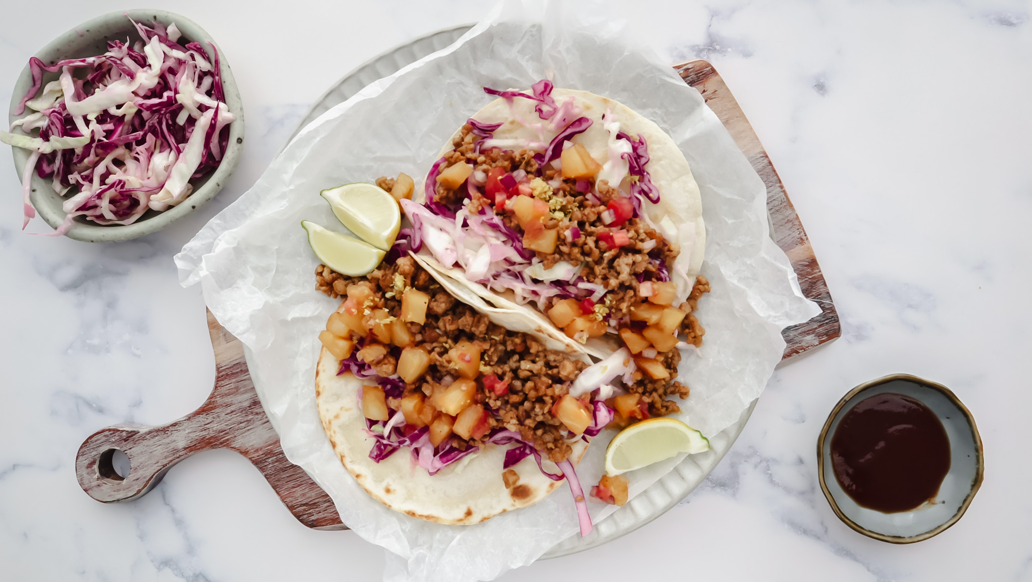 Sticky pork tacos with pineapple & tomato salsa & slaw recipe