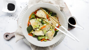 Sweet & soy pork dumplings with veggie stir-fry recipe