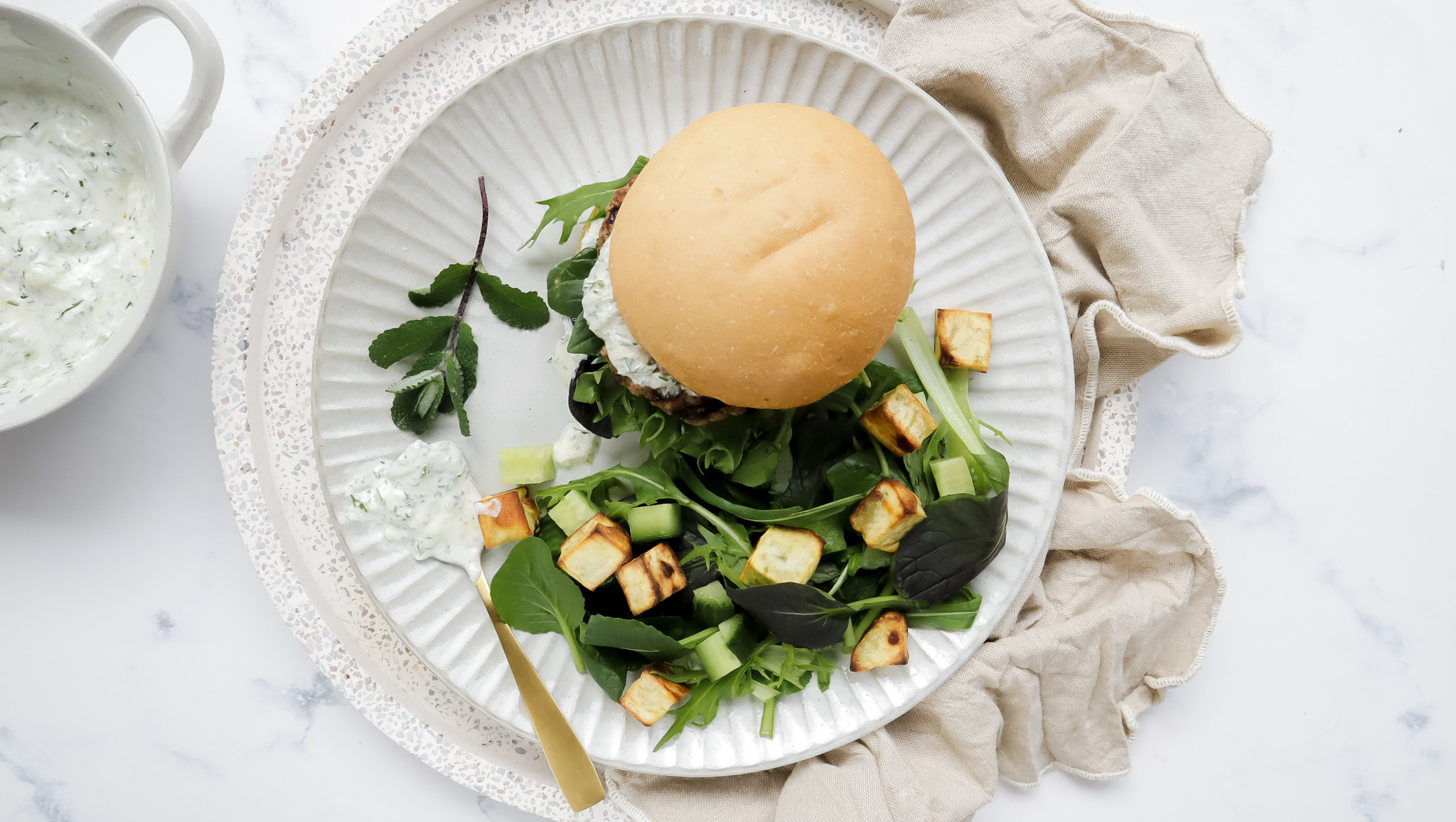 Tzatziki & lamb burger with sweet potato & cucumber salad