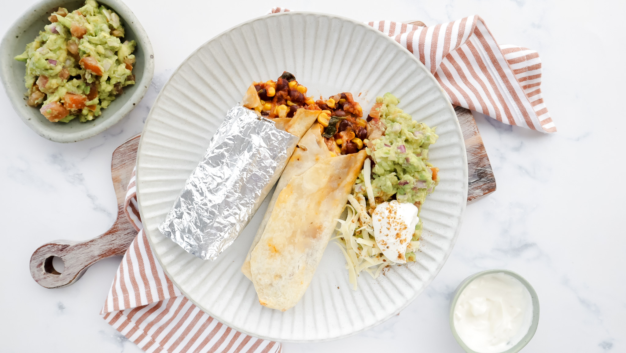 Veggie burrito with cheese, guacamole & sour cream recipe