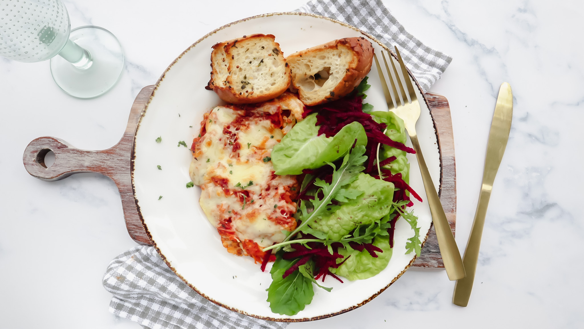 Cheesy cauli bake with garlic bread & fresh garden salad recipe