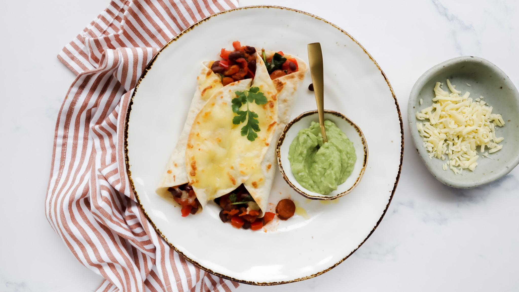 Cheesy chorizo & bean enchiladas with guacamole recipe
