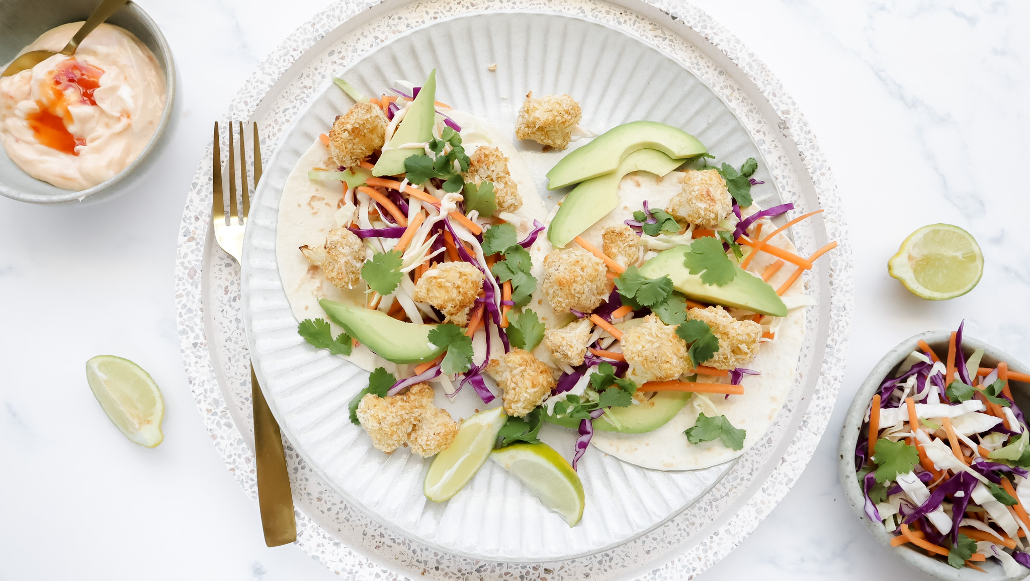 Crispy cauli bites in tacos with slaw, sweet chilli mayo & lime recipe