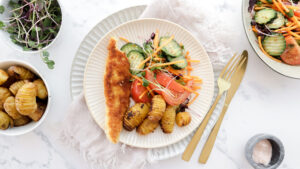 Crispy chicken schnitty, baby hasselback potatoes & salad recipe