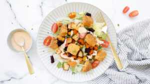 Crispy popcorn chicken with roast veggie salad & sweet chilli mayo recipe