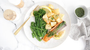 Crispy salmon with roasted potatoes, steamed greens & lemon dill drizzle recipe