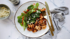 Fresh cheesy tortellini with beef, tomato sauce & salad recipe