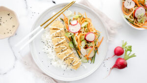 Golden crumbed chicken Katsu with pickles salad, rice & soy mayo