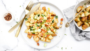 Grilled haloumi & corn salsa with golden roasties recipe