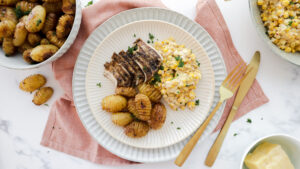 Mexican chicken & creamy corn salad with mini hasselback potatoes