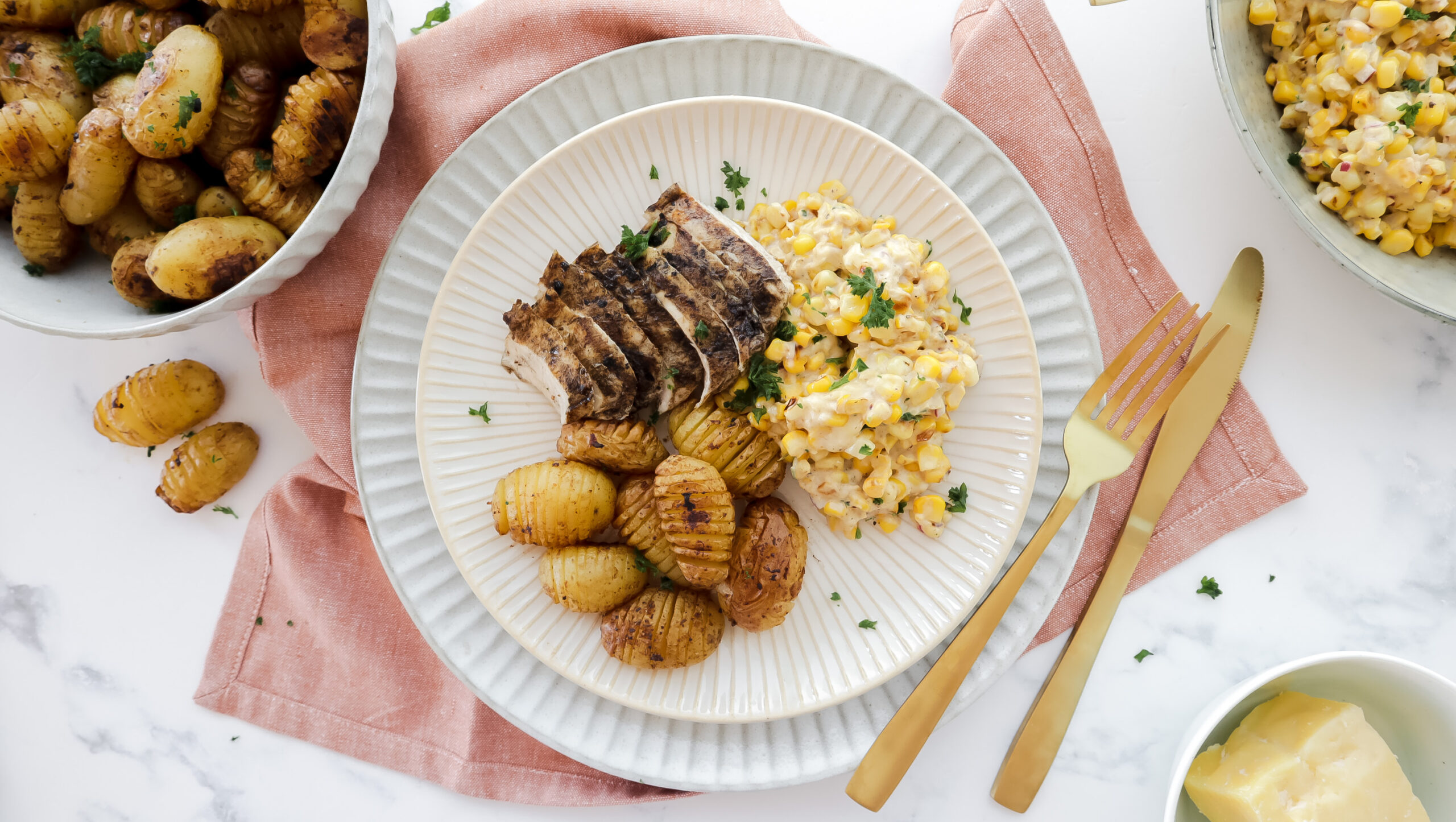 Mexican chicken & creamy corn salad with mini hasselback potatoes