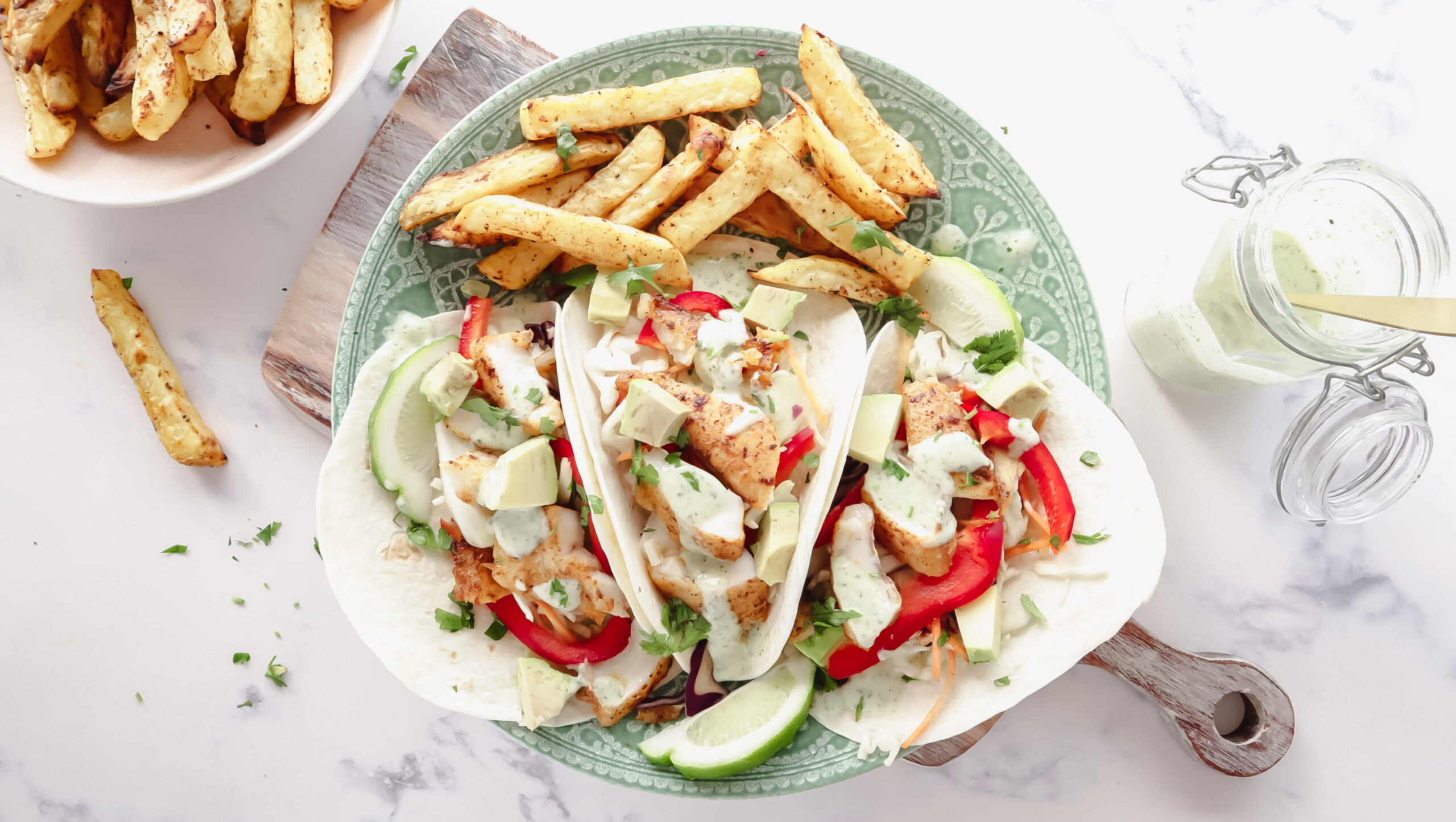 Mexican fish tacos with slaw, creamy lime dressing & fries recipe