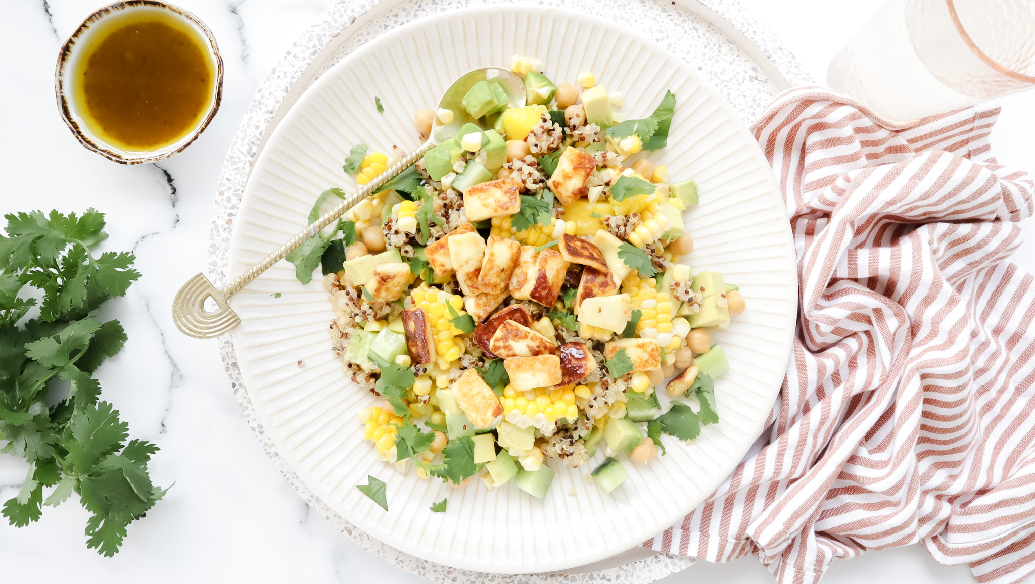 Mexican quinoa, corn, avo & mango salad with honey fried haloumi recipe