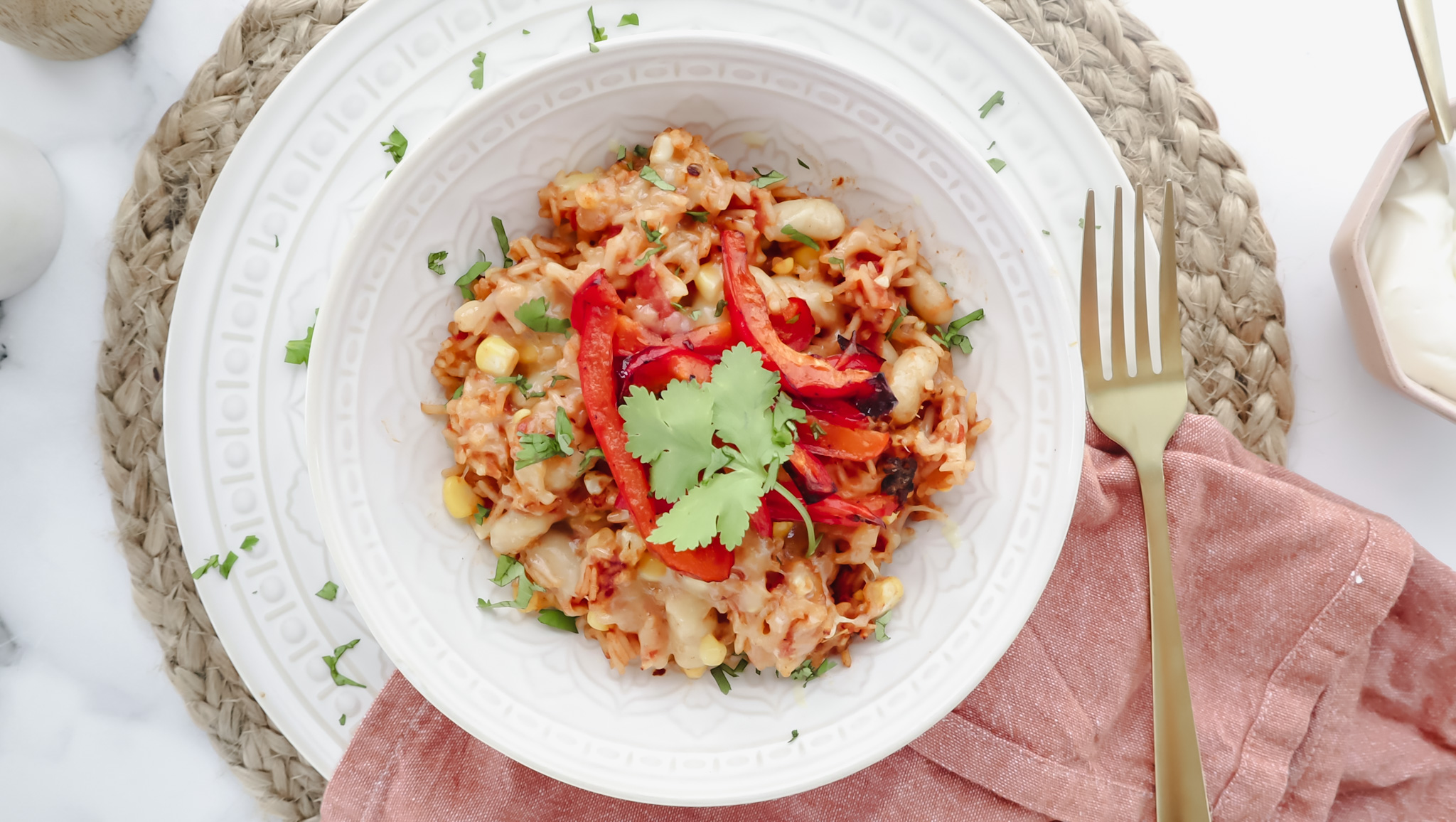 Cheesy corn, bean & rice bake with grilled capsicum & sour cream recipe