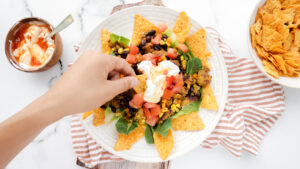 Mexican falafel nacho salad with corn chips & sweet chilli cream recipe