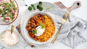 Quick Mexican beef, rice & slaw bowls with cheese & sweet chilli cream recipe