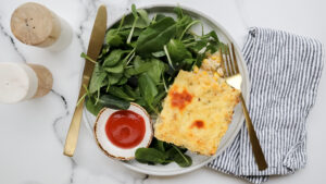 Salmon & rice bake with crispy cheese topping & salad recipe