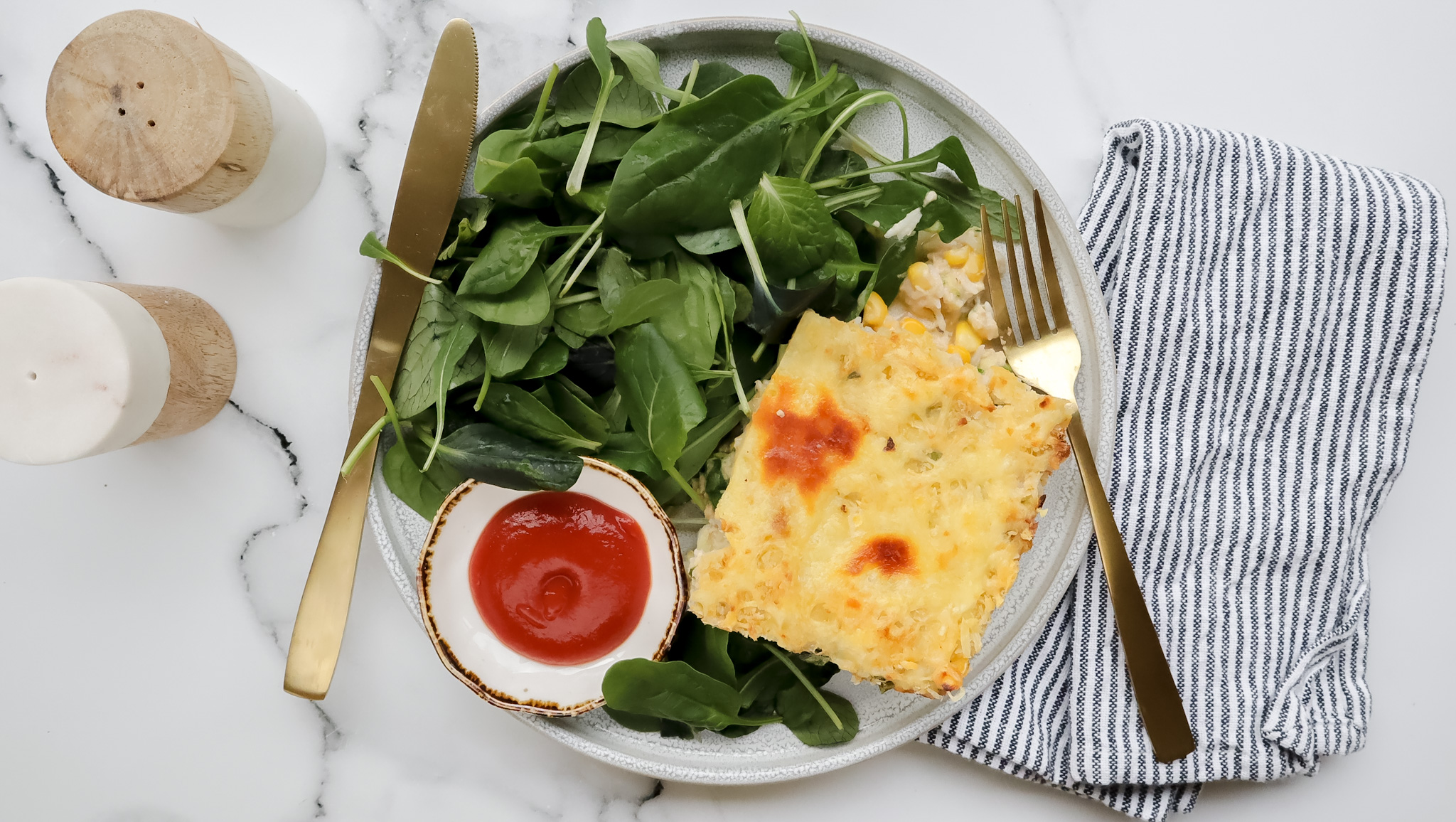 Salmon & rice bake with crispy cheese topping & salad recipe