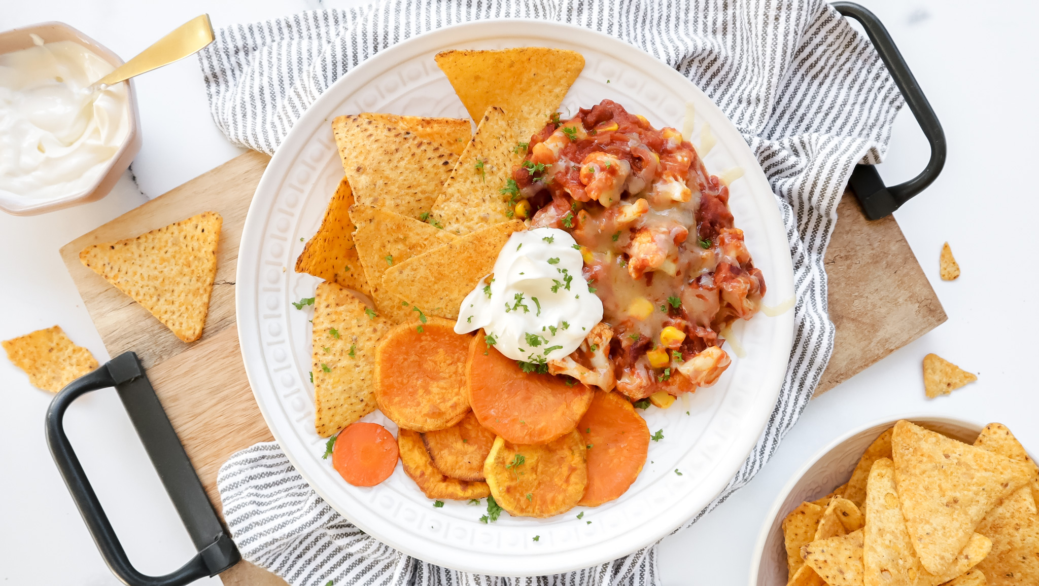 Mexican cauliflower & veggies with corn chips & sour cream